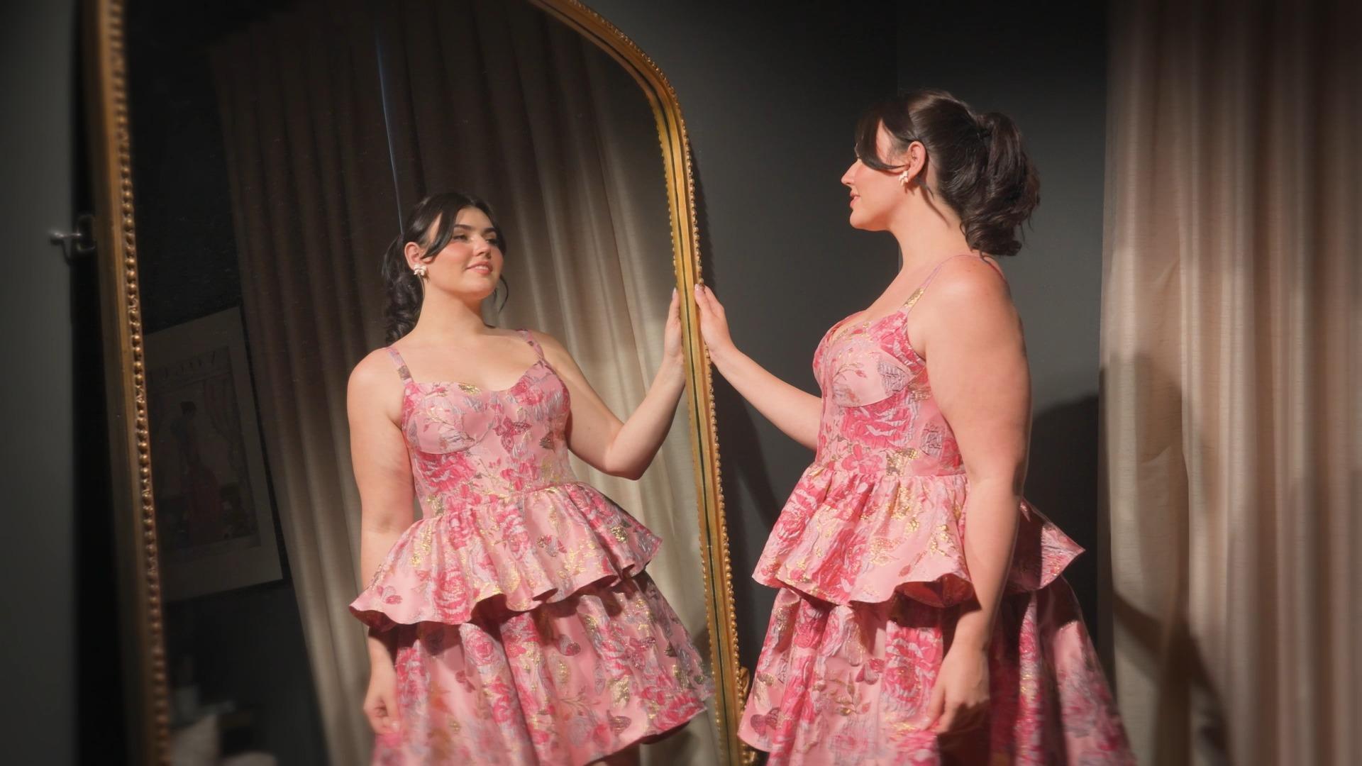 Young woman trying on a homecoming dress in Nashua